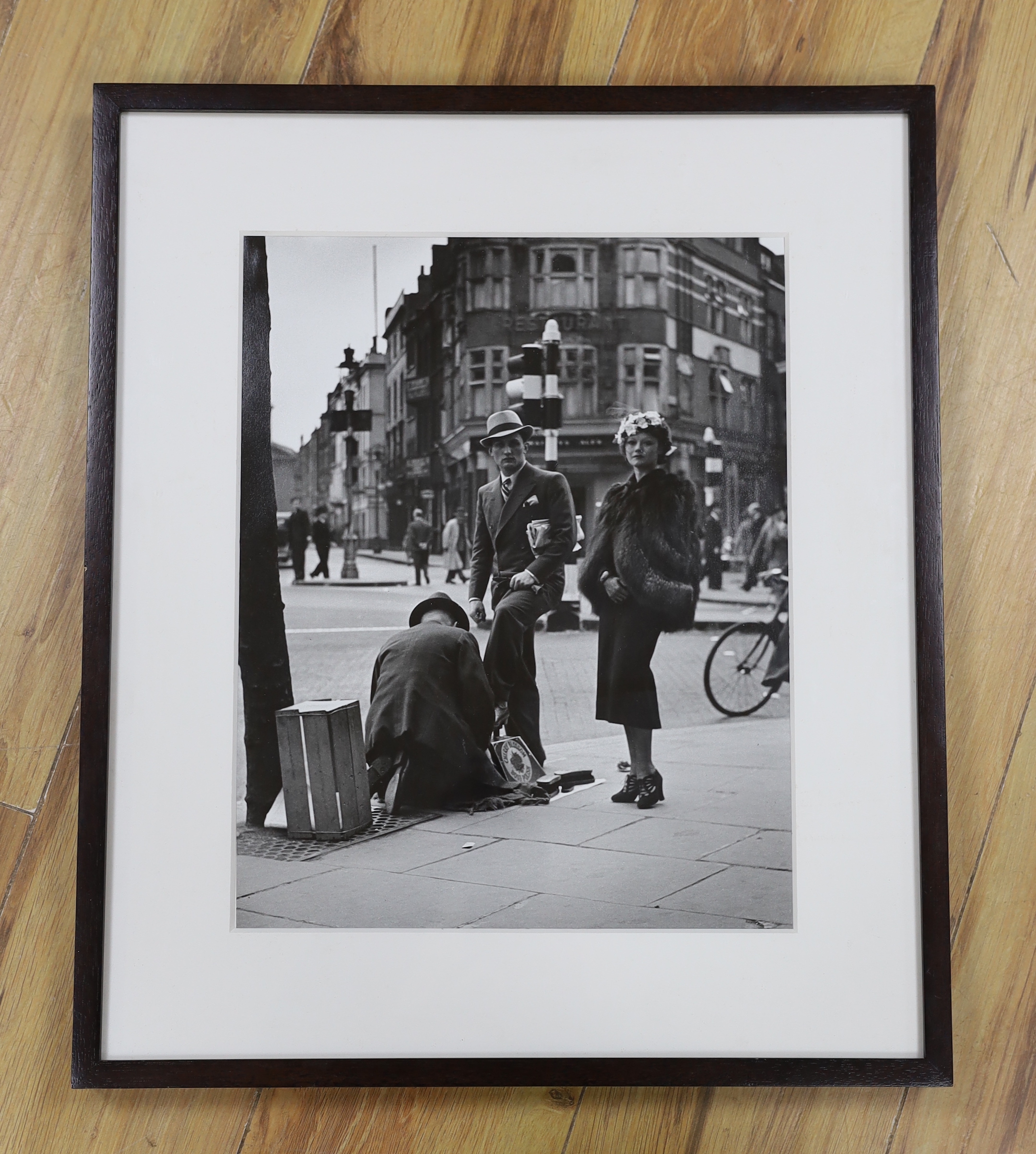 Wolfgang Suschitzky (Austrian/British, 1912-2016), gelatin-silver print, 'Charing Cross Road, shoe-shine', signed verso, 36 x 29cm